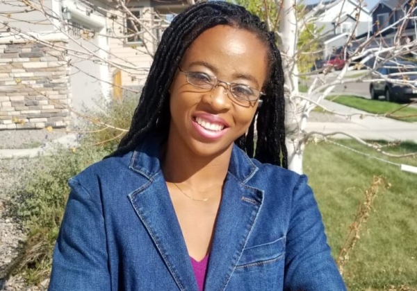 African American Woman wearing glasses Smiling